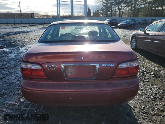 2000 Mazda 626 LX z VIN 1YVGF22CXY5172092, wystawiony jako Copart lot #81960694 z przebiegiem 214 185 mil mil oraz Szkoda całkowita • Salvage title. Historia ofert i sprzedaży dostępna na DreamBid. Obrazek 6.
