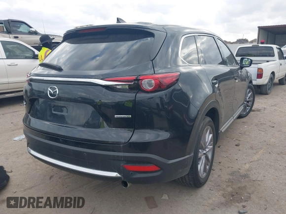 2023 Mazda CX-9 Grand Touring with VIN JM3TCBDY2P0632239, listed as a IAAI auction lot 41543302 with 56,603 mi miles and . Bid and sale history available at carsss.com. Image 4.