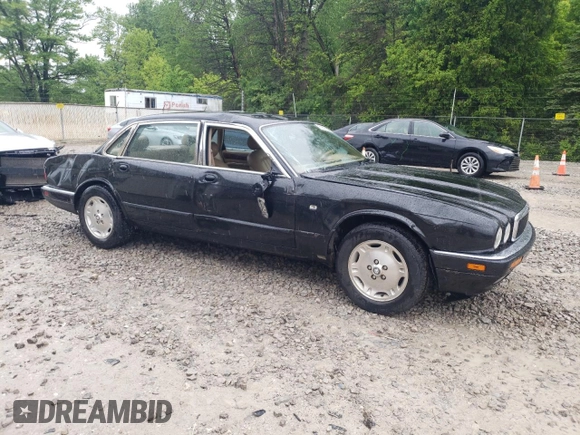 1997 Jaguar XJ with VIN SAJHX6248VC806189, listed as a Copart auction lot 57891035 with 51,654 mi miles and Salvage title. Bid and sale history available at DreamBid. Image 4.