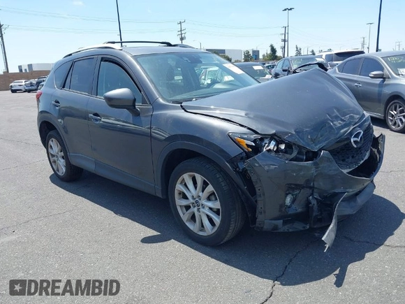 2014 Mazda CX-5 Grand Touring with VIN JM3KE4DY8E0391317, listed as a IAAI auction lot 41871641 with 77,048 mi miles. Bid and sale history available at carsss.com. Image 1.