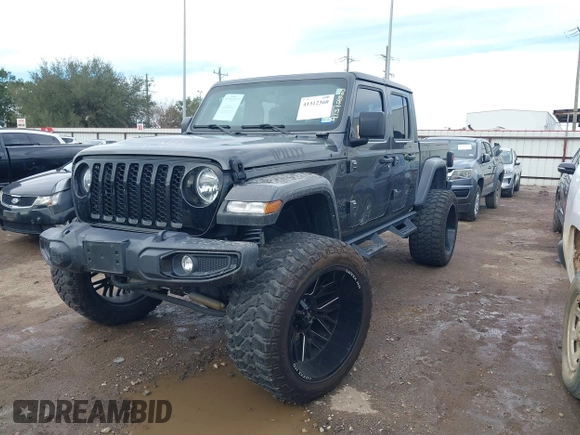 2023 Jeep Gladiator Sport S z VIN 1C6HJTAG9PL554845, wystawiony jako IAAI lot #41312360 z przebiegiem 18 077 mil mil oraz . Historia ofert i sprzedaży dostępna na DreamBid. Obrazek 2.
