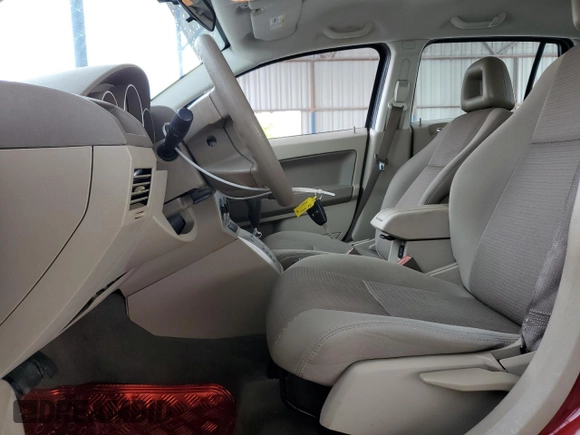 2009 Dodge Caliber SXT z VIN 1B3HB48A29D156808, wystawiony jako Copart lot #52732095 z przebiegiem 99 613 mil mil oraz Szkoda całkowita • Salvage title. Historia ofert i sprzedaży dostępna na DreamBid. Obrazek 7.