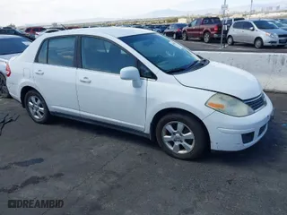 2007 Nissan Versa 1.8 S with VIN 3N1BC11E47L439072, listed as a IAAI auction lot 42083801 with 215,096 mi miles. Bid and sale history available at carsss.com. Image 1.