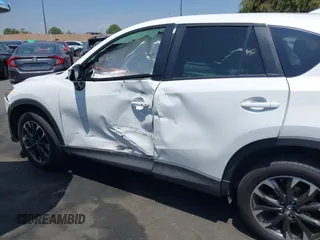 2016 Mazda CX-5 Grand Touring z VIN JM3KE2DY2G0824802, wystawiony jako IAAI lot #42170591 z przebiegiem 53 173 mil mil oraz . Historia ofert i sprzedaży dostępna na DreamBid. Obrazek 6.