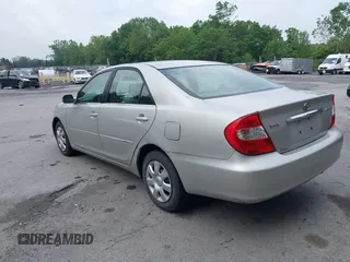 2004 Toyota Camry LE with VIN 4T1BE32K14U857478, listed as a IAAI auction lot 42654878 with 210,542 mi miles and . Bid and sale history available at DreamBid. Image 3.