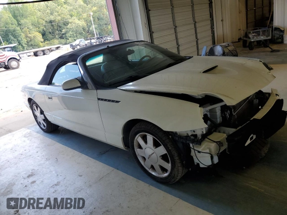 2002 Ford Thunderbird Hardtop Premium z VIN 1FAHP60A52Y130277, wystawiony jako Copart lot #69473594 z przebiegiem Nie podano mil oraz Szkoda całkowita • Salvage title. Historia ofert i sprzedaży dostępna na DreamBid. Obrazek 4.