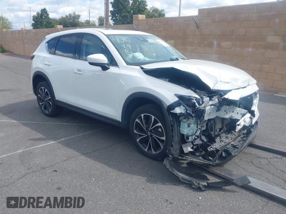 2023 Mazda CX-5 2.5 S Premium Plus Package with VIN JM3KFBEM4P0112803, listed as a IAAI auction lot 41588872 with 25,087 mi miles. Bid and sale history available at carsss.com. Image 1.