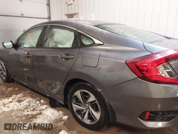 2020 Honda Civic LX z VIN 19XFC2F65LE030888, wystawiony jako IAAI lot #41609630 z przebiegiem 115 614 mil mil oraz . Historia ofert i sprzedaży dostępna na DreamBid. Obrazek 14.