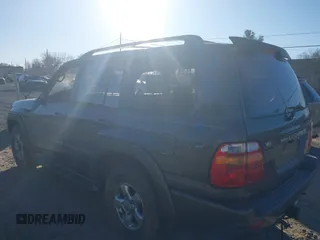 2002 Toyota Land Cruiser with VIN JTEHT05J122022183, listed as a IAAI auction lot 41440395 with 288,686 mi miles. Bid and sale history available at carsss.com. Image 3.