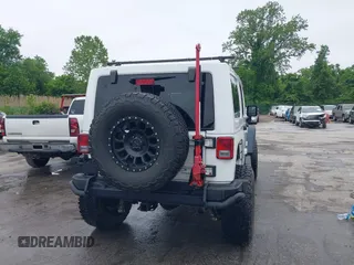 2014 Jeep Wrangler Unlimited Rubicon with VIN 1C4HJWFG4EL104827, listed as a IAAI auction lot 42236622 with 90,935 mi miles and . Bid and sale history available at DreamBid. Image 17.