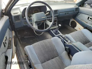 1985 Toyota Supra z VIN JT2MA67L3F0151708, wystawiony jako Copart lot #74672844 z przebiegiem 60 346 mil mil oraz Szkoda całkowita • Salvage title. Historia ofert i sprzedaży dostępna na DreamBid. Obrazek 8.