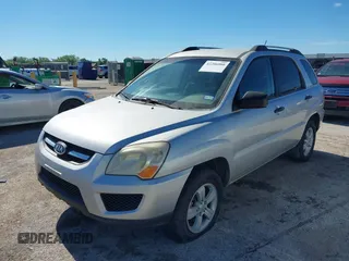 2009 Kia Sportage LX with VIN KNDJF724X97556574, listed as a IAAI auction lot 42206080 with 115,868 mi miles and . Bid and sale history available at carsss.com. Image 2.