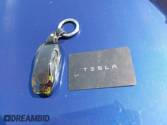 2021 Tesla Model S Long Range with VIN 5YJSA1E51MF442874, listed as a IAAI auction lot 39406495 with 36,127 mi miles and . Bid and sale history available at DreamBid. Image 11.