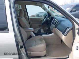 2006 Mazda Tribute S with VIN 4F2YZ04136KM15337, listed as a IAAI auction lot 41689177 with 153,720 mi miles and . Bid and sale history available at DreamBid. Image 5.