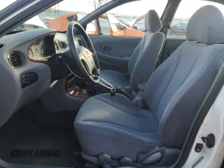 2000 Hyundai Elantra GLS z VIN KMHJF35F4YU038977, wystawiony jako Copart lot #80800144 z przebiegiem 97 373 mil mil oraz Czysty tytuł • Clean title. Historia ofert i sprzedaży dostępna na DreamBid. Obrazek 7.