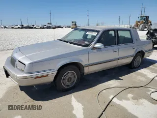 1992 Chrysler New Yorker z VIN 1C3XC66R4ND782435, wystawiony jako Copart lot #50000075 z przebiegiem 146 097 mil mil oraz Tytuł czysty. Historia ofert i sprzedaży dostępna na DreamBid. Obrazek 1.