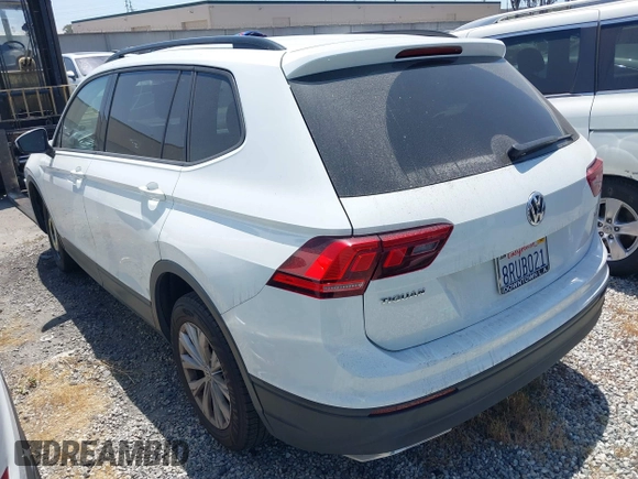 2018 Volkswagen Tiguan S with VIN 3VV1B7AX8JM032990, listed as a IAAI auction lot 42279807 with 74,185 mi miles and . Bid and sale history available at DreamBid. Image 3.