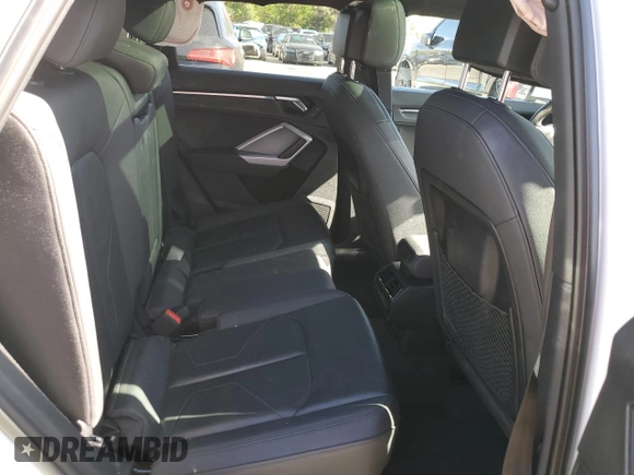 2021 Audi Q3 Premium z VIN WA1AUCF38M1067676, wystawiony jako Copart lot #71621704 z przebiegiem 77 395 mil mil oraz Szkoda całkowita • Salvage title. Historia ofert i sprzedaży dostępna na DreamBid. Obrazek 10.
