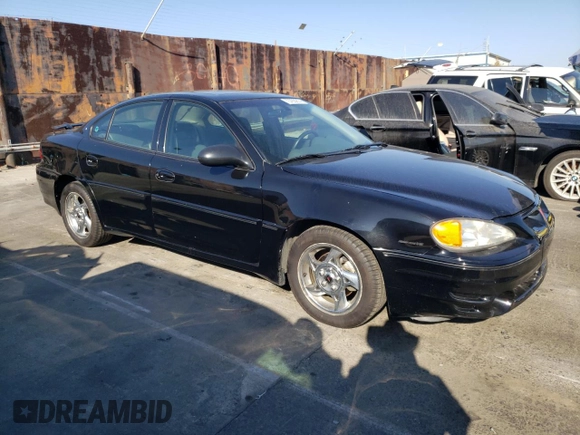 2002 Pontiac Grand Am GT with VIN 1G2NW52E12M704539, listed as a Copart auction lot 73755214 with 100,904 mi miles and Clean Title. Bid and sale history available at carsss.com. Image 4.