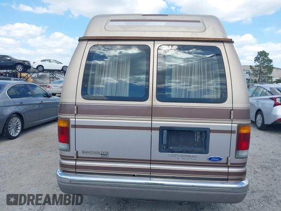 1994 Ford Econoline Cargo with VIN 1FDEE14N5RHB72537, listed as a IAAI auction lot 41968893 with 245,866 mi miles. Bid and sale history available at carsss.com. Image 16.