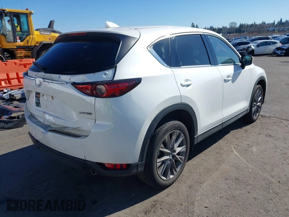 2021 Mazda CX-5 Grand Touring with VIN JM3KFBDM6M0483135, listed as a IAAI auction lot 41590430 with 33,466 mi miles. Bid and sale history available at carsss.com. Image 4.