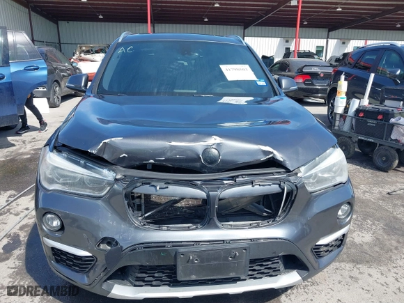 2017 BMW X1 xDrive28i with VIN WBXHT3Z33H4A65198, listed as a IAAI auction lot 41798503 with 88,951 mi miles. Bid and sale history available at carsss.com. Image 12.