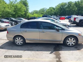 2006 Honda Civic LX z VIN 1HGFA16586L083119, wystawiony jako IAAI lot #42237313 z przebiegiem Nie podano mil oraz . Historia ofert i sprzedaży dostępna na DreamBid. Obrazek 14.