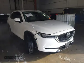 2021 Mazda CX-5 Grand Touring with VIN JM3KFADM3M0312143, listed as a IAAI auction lot 41606582 with 46,515 mi miles. Bid and sale history available at carsss.com. Image 1.
