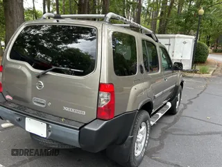 2004 Nissan Xterra XE with VIN 5N1ED28Y44C656024, listed as a Copart auction lot 61629985 with 216,348 mi miles and Clean title. Bid and sale history available at DreamBid. Image 4.