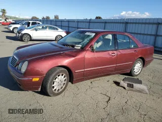 2000 Mercedes-Benz E-Class with VIN WDBJF65J7YA984405, listed as a Copart auction lot 49168555 with 141,477 mi miles and Salvage Title. Bid and sale history available at carsss.com. Image 1.