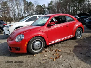 2012 Volkswagen Beetle 2.5L PZEV with VIN 3VWJP7AT0CM601196, listed as a Copart auction lot 44962065 with 128,597 mi miles and Salvage Title. Bid and sale history available at carsss.com. Image 1.