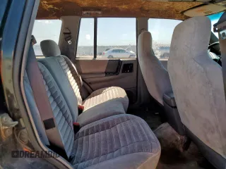 1995 Jeep Grand Cherokee Laredo z VIN 1J4FX58S9SC534442, wystawiony jako Copart lot #61233725 z przebiegiem 363 688 mil mil oraz Szkoda całkowita • Salvage title. Historia ofert i sprzedaży dostępna na DreamBid. Obrazek 11.