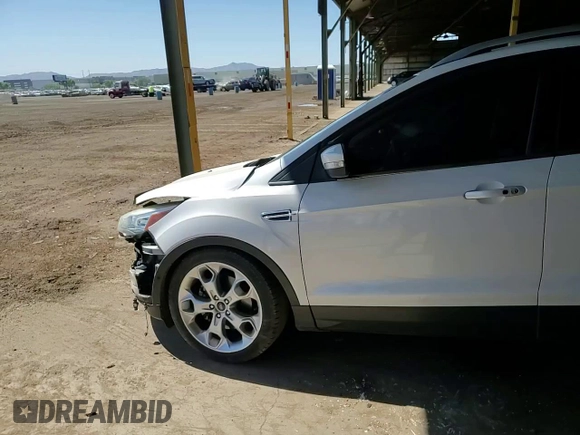 2016 Ford Escape Titanium with VIN 1FMCU9J91GUA11090, listed as a Copart auction lot 54231675 with 135,735 mi miles and Salvage Title. Bid and sale history available at DreamBid. Image 14.