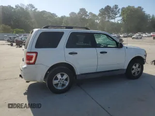 2009 Ford Escape XLS with VIN 1FMCU02719KB53740, listed as a Copart auction lot 55210035 with 144,672 mi miles and Salvage title. Bid and sale history available at DreamBid. Image 3.