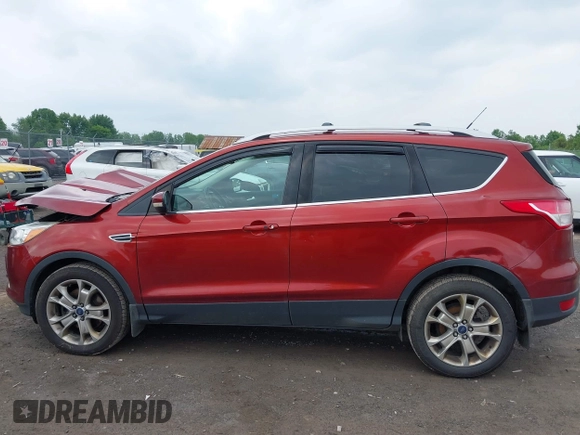 2015 Ford Escape Titanium z VIN 1FMCU9J98FUC84963, wystawiony jako IAAI lot #42469112 z przebiegiem 128 838 mil mil oraz . Historia ofert i sprzedaży dostępna na DreamBid. Obrazek 14.