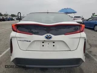 2021 Toyota Prius LE z VIN JTDKAMFP9M3196770, wystawiony jako Copart lot #54309555 z przebiegiem 21 948 mil mil oraz Szkoda całkowita • Salvage title. Historia ofert i sprzedaży dostępna na DreamBid. Obrazek 6.