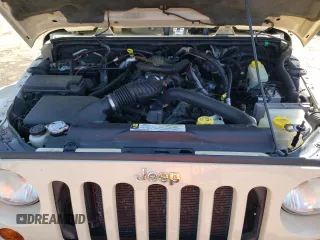 2011 Jeep Wrangler Sahara z VIN 1J4AA5D10BL528862, wystawiony jako Copart lot #53488515 z przebiegiem 198 865 mil mil oraz Szkoda całkowita • Salvage title. Historia ofert i sprzedaży dostępna na DreamBid. Obrazek 11.