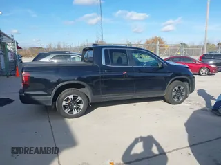 2020 Honda Ridgeline RTL with VIN 5FPYK3F59LB023212, listed as a IAAI auction lot 40704228 with 73,259 mi miles and . Bid and sale history available at DreamBid. Image 14.
