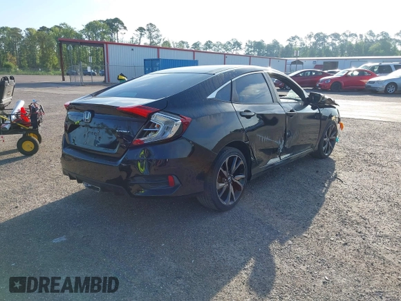 2019 Honda Civic Sport with VIN 2HGFC2F82KH553176, listed as a IAAI auction lot 42395963 with 73,950 mi miles and . Bid and sale history available at DreamBid. Image 4.