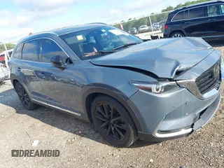 2021 Mazda CX-9 Grand Touring with VIN JM3TCADY7M0528223, listed as a IAAI auction lot 42395861 with 57,767 mi miles and . Bid and sale history available at DreamBid. Image 1.