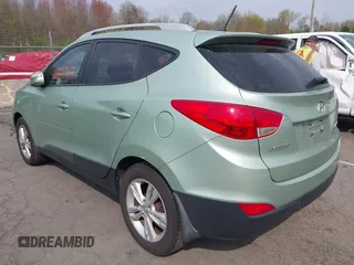 2013 Hyundai Tucson GLS with VIN KM8JU3AC7DU580229, listed as a IAAI auction lot 42127349 with 204,975 mi miles. Bid and sale history available at carsss.com. Image 3.