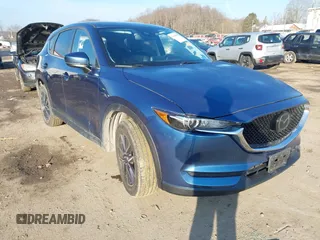 2018 Mazda CX-5 Touring z VIN JM3KFBCM2J0461954, wystawiony jako IAAI lot #41655865 z przebiegiem 129 333 mil mil oraz . Historia ofert i sprzedaży dostępna na DreamBid. Obrazek 1.