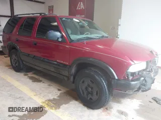 1999 Chevrolet Blazer Trailblazer z VIN 1GNDT13W4X2187490, wystawiony jako IAAI lot #41966073 z przebiegiem 187 604 mil mil oraz . Historia ofert i sprzedaży dostępna na DreamBid. Obrazek 1.