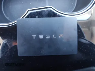 2018 Tesla Model 3 Long Range Battery with VIN 5YJ3E1EB9JF065057, listed as a IAAI auction lot 41863903 with 54,584 mi miles and . Bid and sale history available at DreamBid. Image 11.