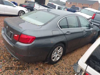 2012 BMW 5 Series 528i with VIN WBAXG5C53CDY28309, listed as a IAAI auction lot 41064233 with 129,915 mi miles. Bid and sale history available at carsss.com. Image 4.
