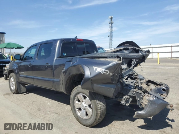 2015 Toyota Tacoma with VIN 3TMMU4FN7FM078006, listed as a Copart auction lot 59129495 with 244,062 mi miles and Salvage title. Bid and sale history available at DreamBid. Image 2.