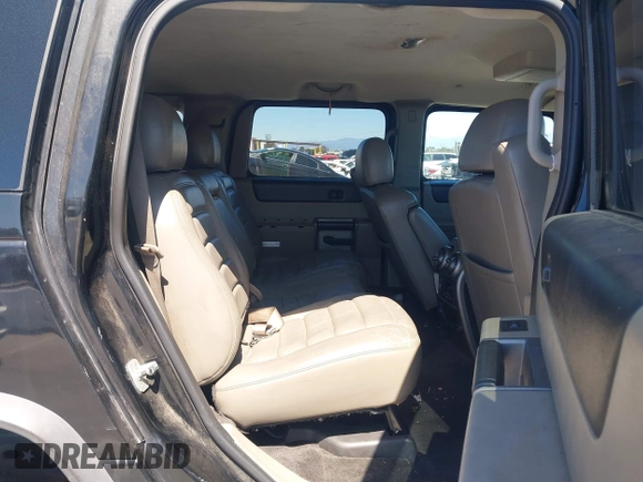 2003 Hummer H2 z VIN 5GRGN23U63H117676, wystawiony jako IAAI lot #41816411 z przebiegiem Nie podano mil oraz . Historia ofert i sprzedaży dostępna na DreamBid. Obrazek 8.