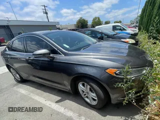 2018 Ford Fusion SE z VIN 3FA6P0HD4JR171502, wystawiony jako Copart lot #60150025 z przebiegiem 106 067 mil mil oraz Czysty tytuł • Clean title. Historia ofert i sprzedaży dostępna na DreamBid. Obrazek 1.