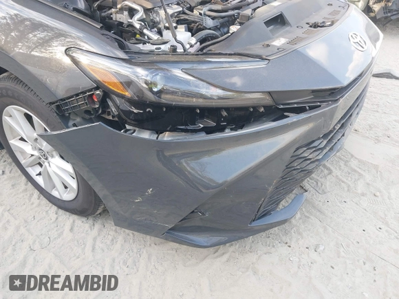 2025 Toyota Camry LE with VIN 4T1DAACKXSU541257, listed as a IAAI auction lot 42052246 with 13,585 mi miles and . Bid and sale history available at DreamBid. Image 6.