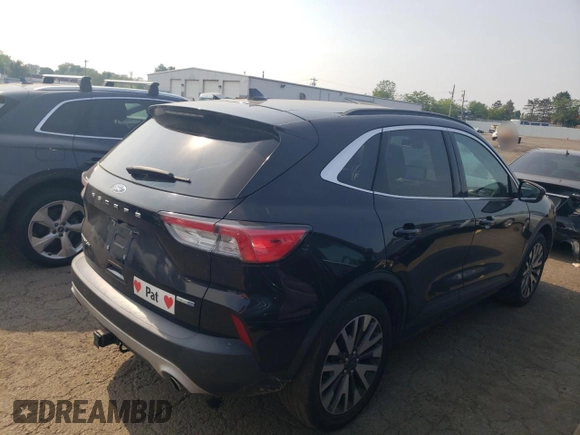 2020 Ford Escape Titanium z VIN 1FMCU9J97LUB25055, wystawiony jako Copart lot #60326945 z przebiegiem 78 711 mil mil oraz Szkoda całkowita • Salvage title. Historia ofert i sprzedaży dostępna na DreamBid. Obrazek 3.